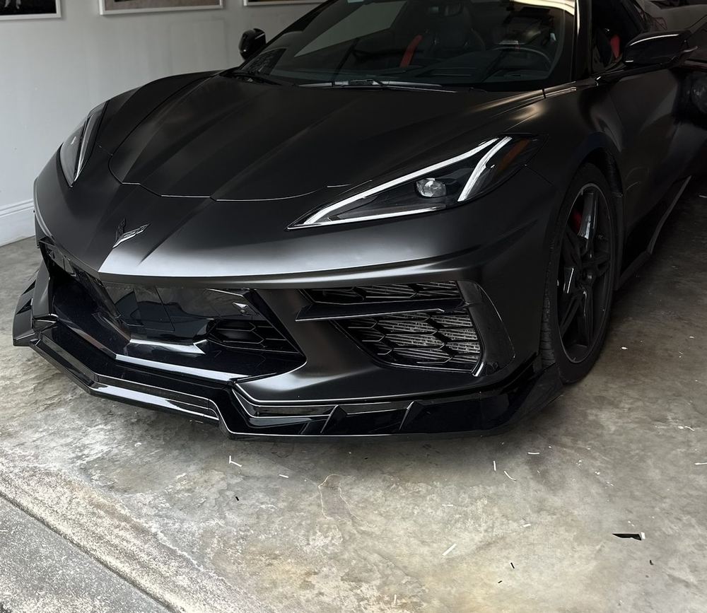 The same Corvette after its satin black Cheetah Wrap color change