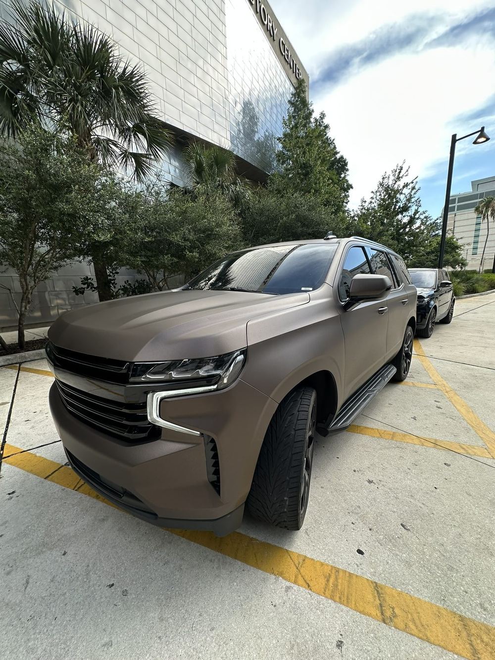 Front three-quarter view of the Java Brown Cheetah Wrap Tahoe